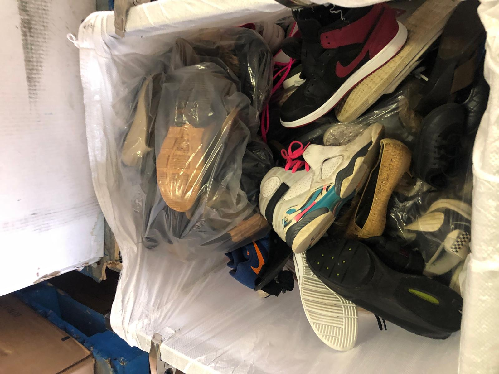 Assorted shoes in a bulk shipment